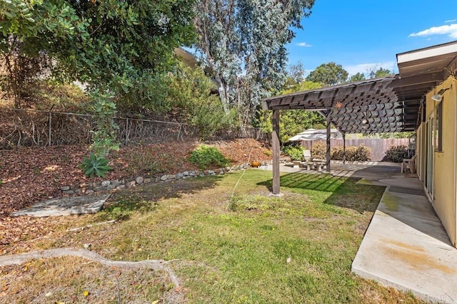 view of yard featuring a fenced backyard, a pergola, and a patio