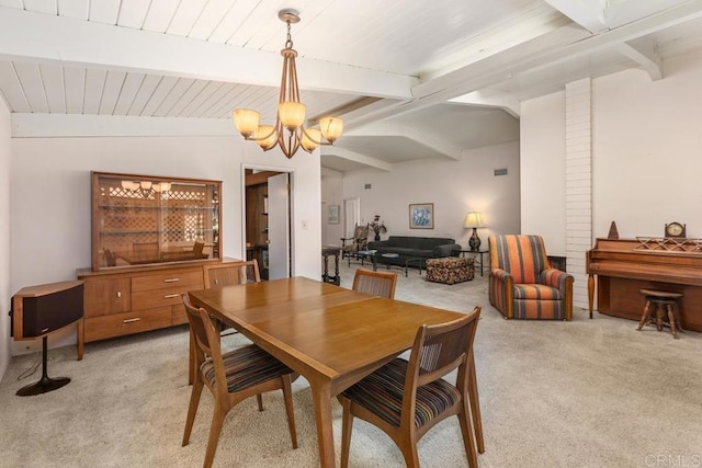 dining space with light carpet, lofted ceiling with beams, and an inviting chandelier