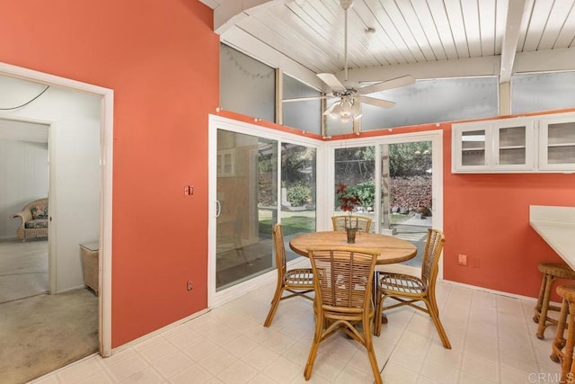 dining area featuring ceiling fan, light floors, vaulted ceiling, and wooden ceiling