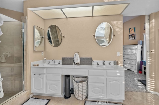 bathroom with vanity and an enclosed shower