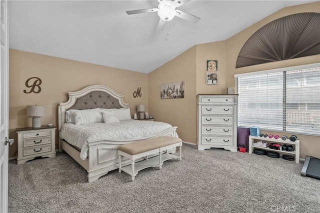 bedroom with ceiling fan, lofted ceiling, and carpet flooring