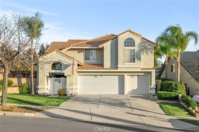 mediterranean / spanish-style house featuring a garage