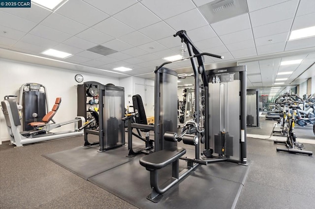 exercise room featuring a drop ceiling