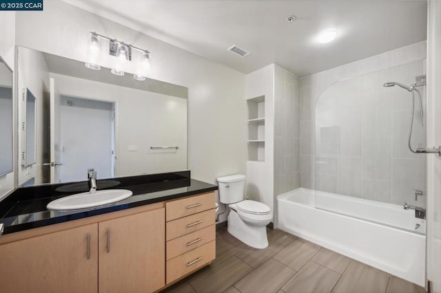 full bathroom featuring vanity, tub / shower combination, and toilet