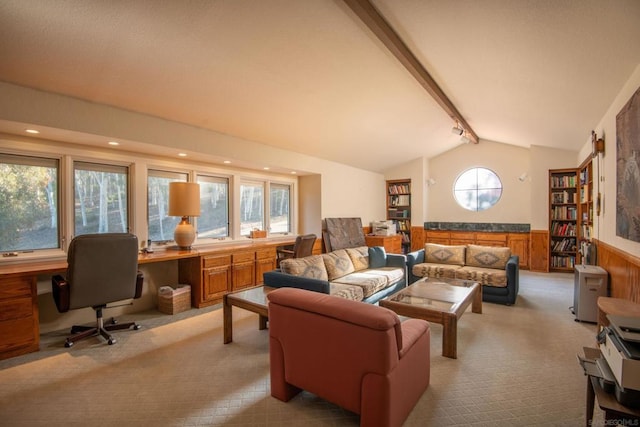 carpeted living room featuring vaulted ceiling with beams, built in desk, and plenty of natural light