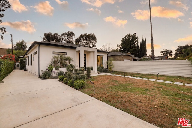 contemporary house featuring a yard