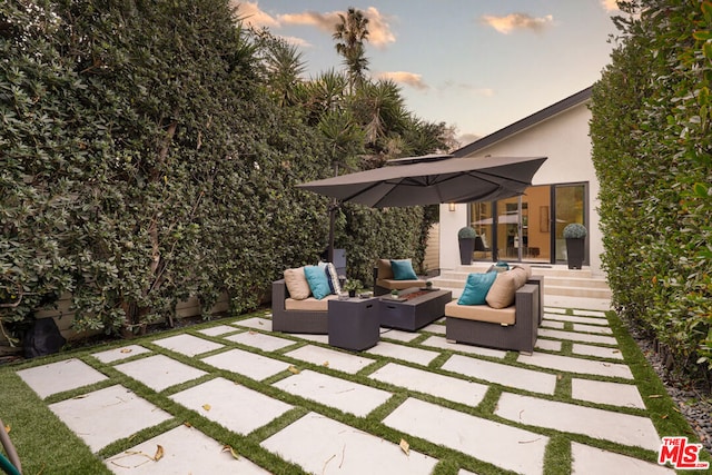 patio terrace at dusk with an outdoor hangout area