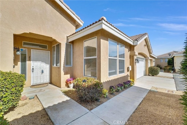 doorway to property featuring a garage