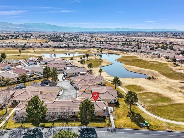 drone / aerial view with a water and mountain view