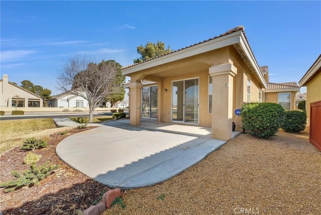 rear view of house featuring a patio