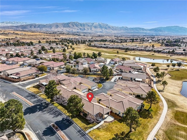 birds eye view of property with a mountain view