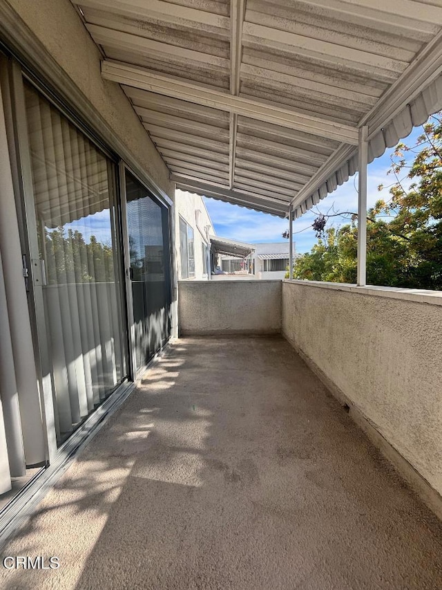 view of patio with a balcony