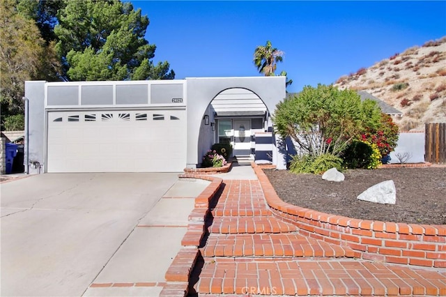 view of front facade featuring a garage and a mountain view