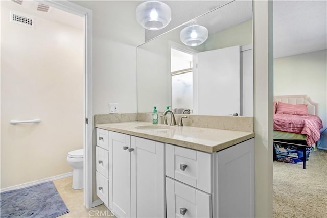 bathroom with vanity and toilet