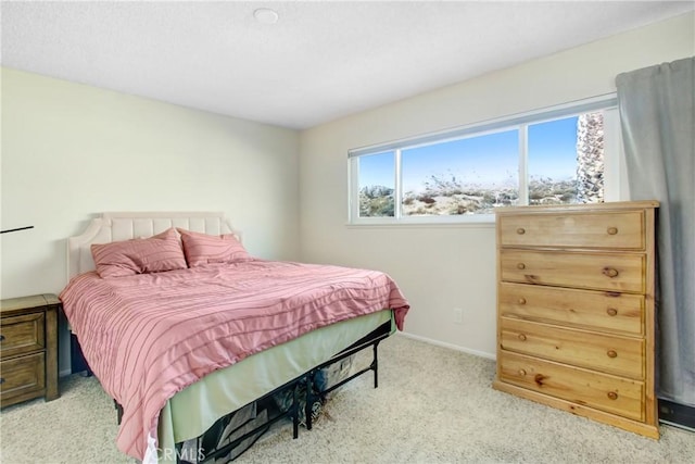 bedroom featuring light colored carpet