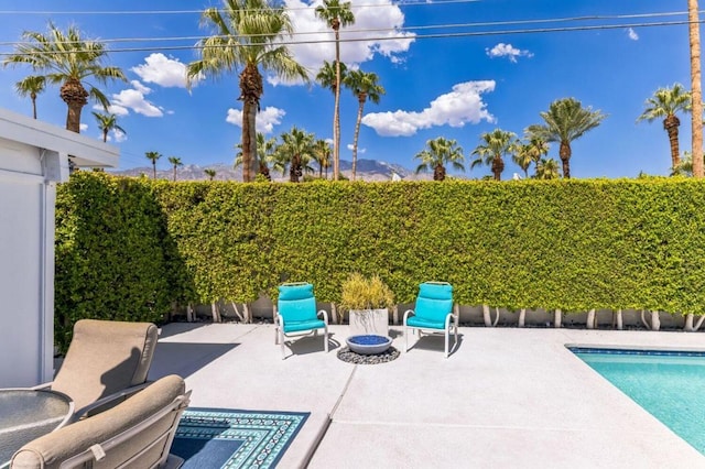 exterior space with a fenced in pool