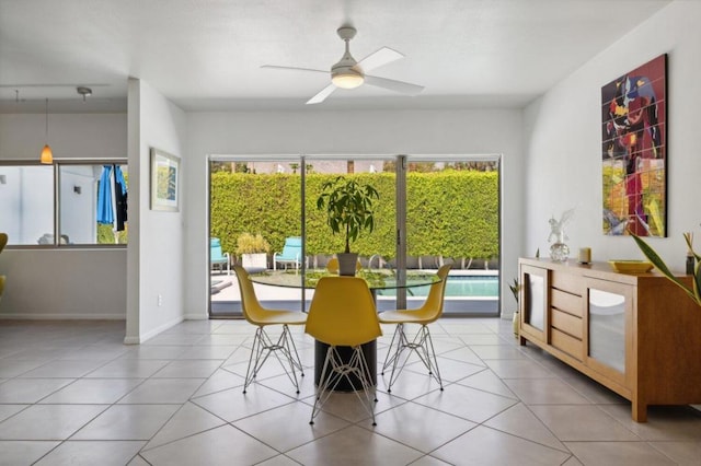 dining area with light tile patterned floors and ceiling fan