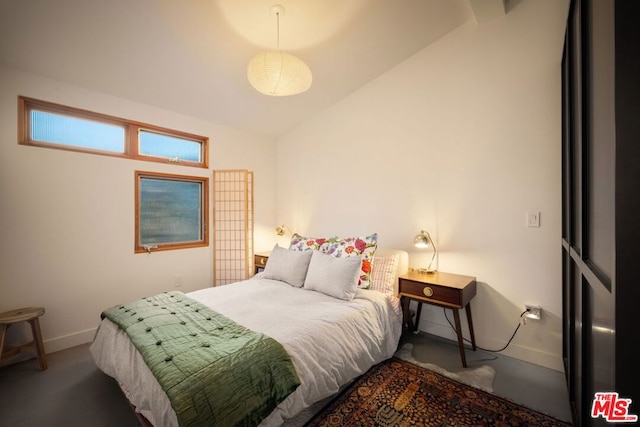 bedroom featuring lofted ceiling