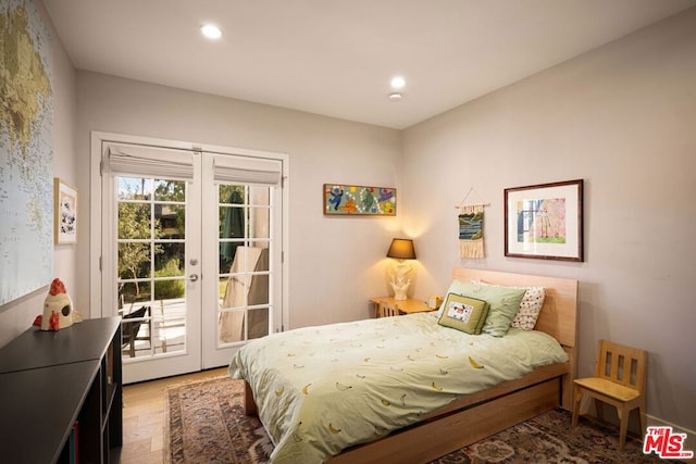 bedroom featuring hardwood / wood-style flooring, access to outside, and french doors