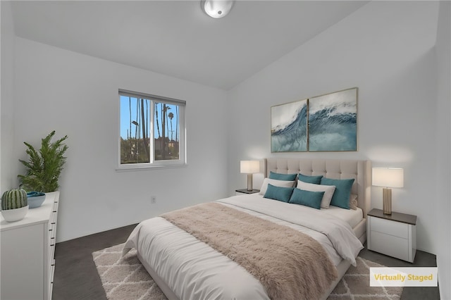 bedroom with lofted ceiling