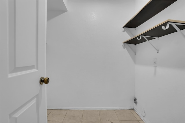 washroom with light tile patterned floors