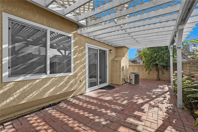 view of patio featuring cooling unit and a pergola