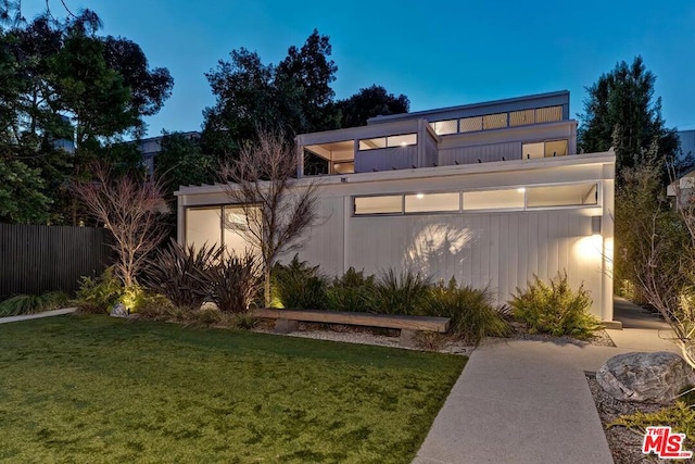 view of front of home with a lawn