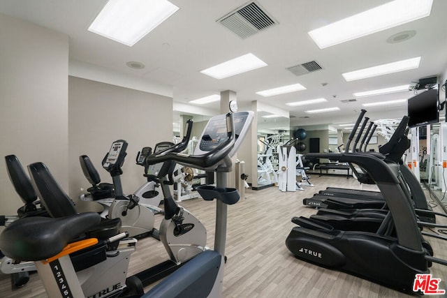 gym featuring light hardwood / wood-style flooring