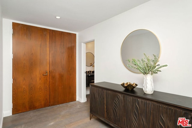 hall with light hardwood / wood-style floors