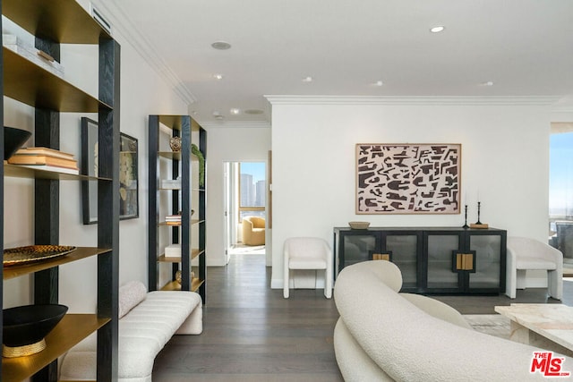 living room with crown molding and dark hardwood / wood-style flooring