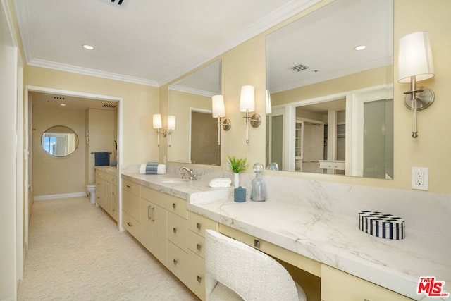 bathroom featuring vanity and ornamental molding