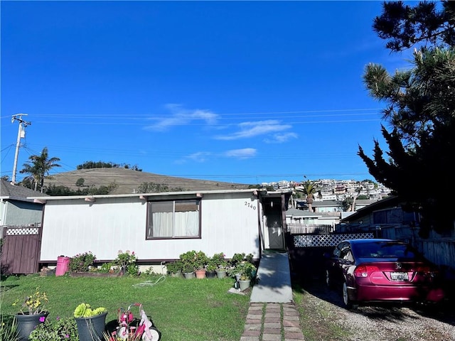 view of side of home featuring a lawn