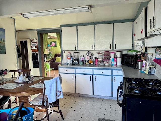 kitchen with white cabinets and black appliances