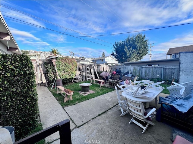 view of patio / terrace with a fire pit