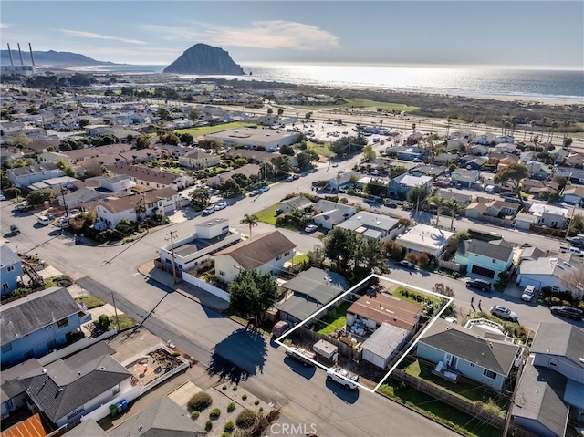 aerial view featuring a water and mountain view