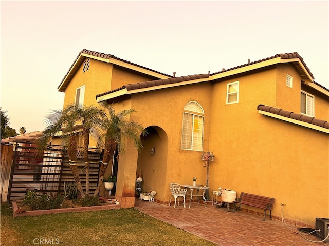 back of house with a patio area