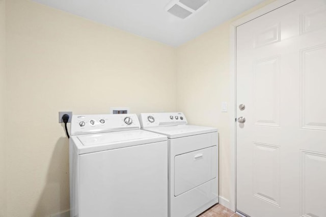 clothes washing area with independent washer and dryer