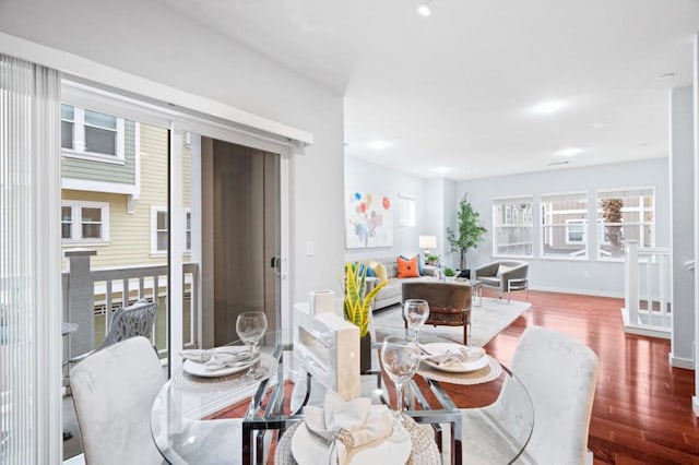 dining space featuring hardwood / wood-style flooring