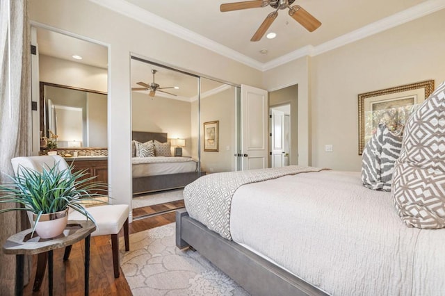 bedroom featuring crown molding, ceiling fan, a closet, and light hardwood / wood-style flooring