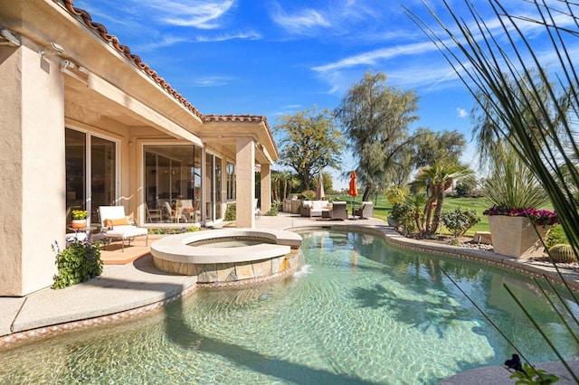 view of swimming pool with an in ground hot tub, an outdoor hangout area, and a patio