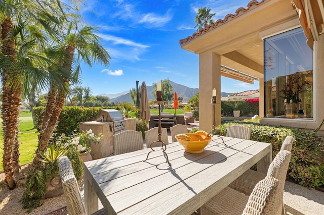 view of patio featuring a mountain view and area for grilling