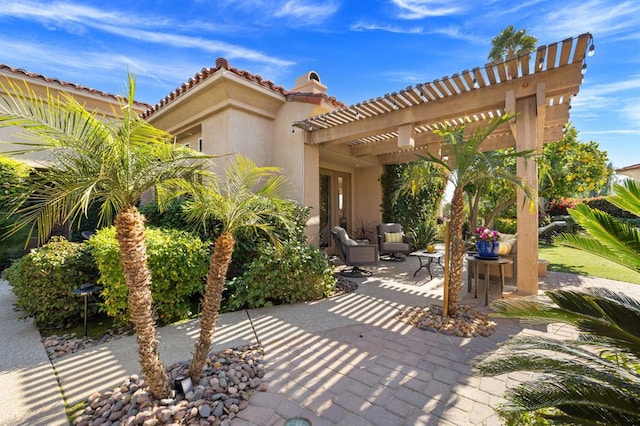 view of patio featuring a pergola and an outdoor hangout area