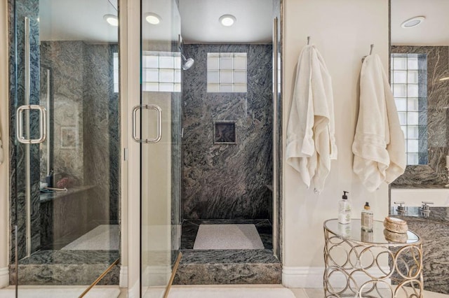 bathroom with a shower with shower door