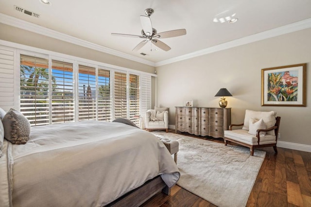 bedroom with ornamental molding, dark hardwood / wood-style floors, and ceiling fan