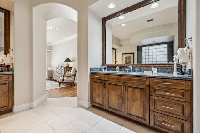 bathroom featuring tile patterned flooring and vanity