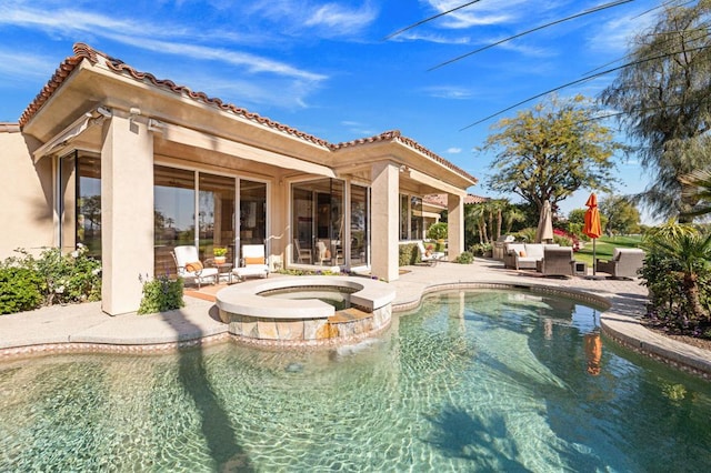 view of swimming pool with an in ground hot tub, an outdoor hangout area, and a patio area