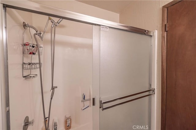 bathroom featuring an enclosed shower