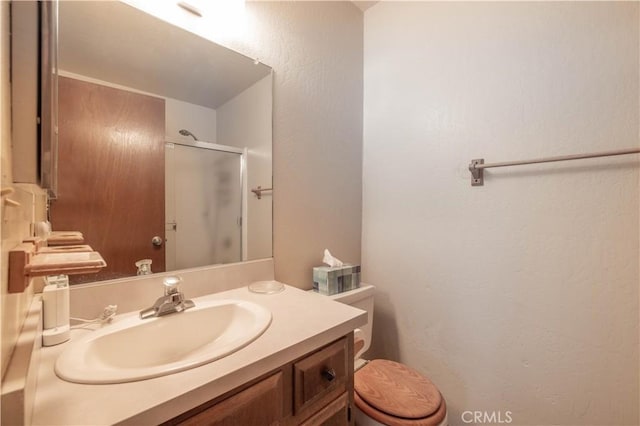 41935 Switzerland Dr Unit 80, Big Bear Lake, CA 92315 - full bath with toilet, vanity, a textured wall, and a shower with door