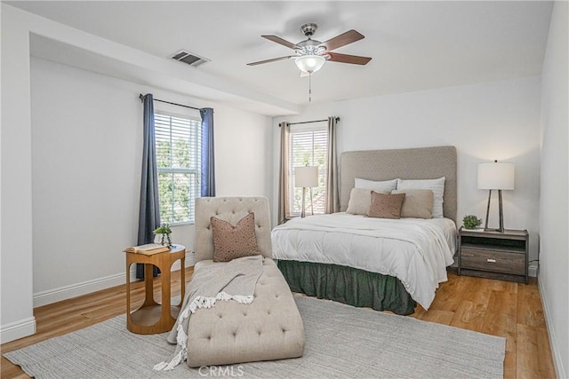 bedroom featuring ceiling fan and light hardwood / wood-style flooring