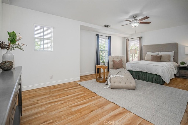 bedroom featuring light hardwood / wood-style flooring and ceiling fan